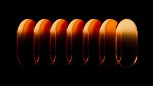 Seven golden ovals in a row on black
