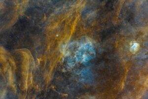 Cosmic nebula with swirling clouds of gas and dust